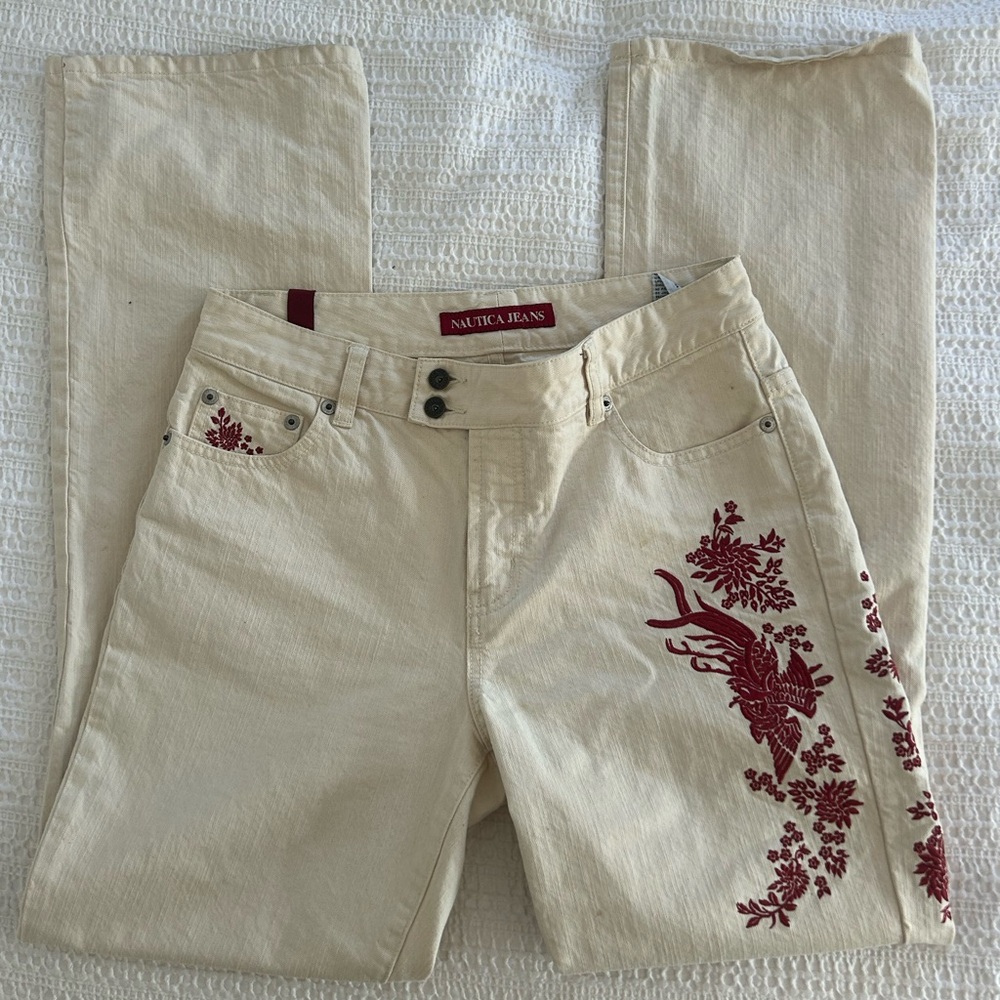 nautica cream jeans with red flower detail
*moderately worn